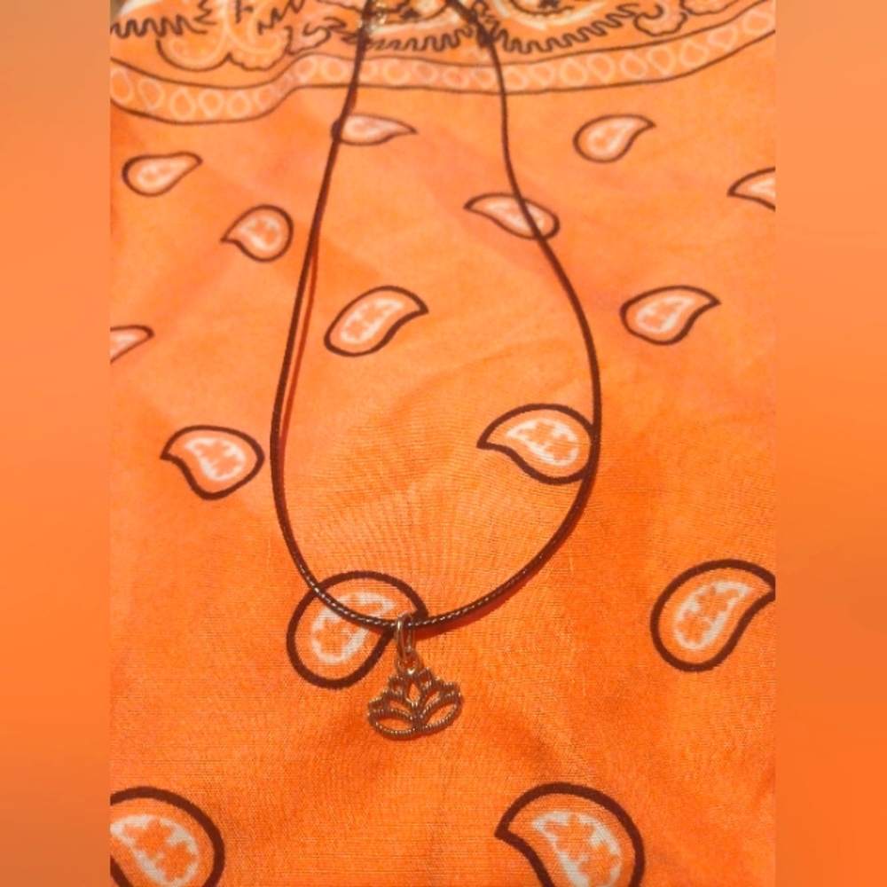 Black cord necklace with charm